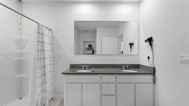 bathroom featuring vanity and tile patterned flooring