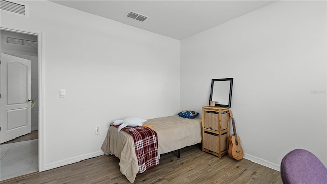 bedroom featuring hardwood / wood-style floors