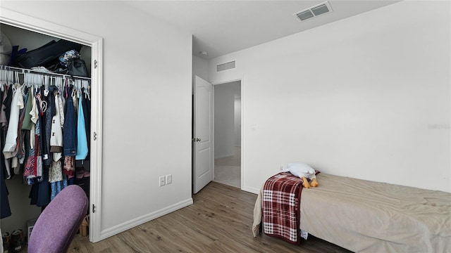 bedroom featuring a closet and hardwood / wood-style floors