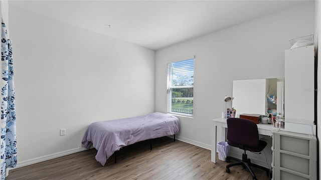 bedroom with hardwood / wood-style floors