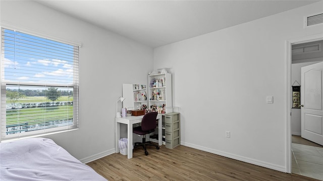 bedroom featuring hardwood / wood-style floors