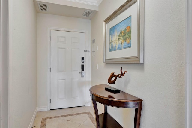 entryway with light tile patterned flooring