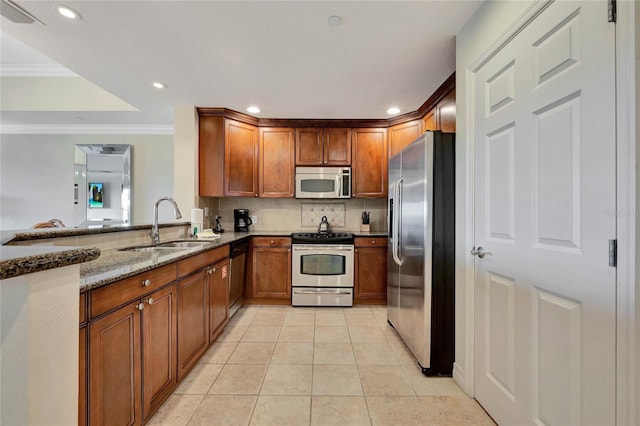 kitchen featuring light tile patterned flooring, ornamental molding, appliances with stainless steel finishes, light stone countertops, and decorative backsplash