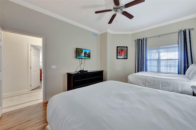 bedroom with wood-type flooring, crown molding, and ceiling fan