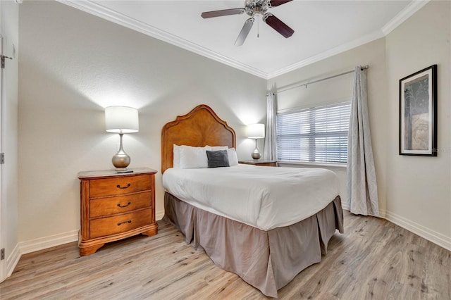 bedroom with light wood-type flooring, ceiling fan, and crown molding