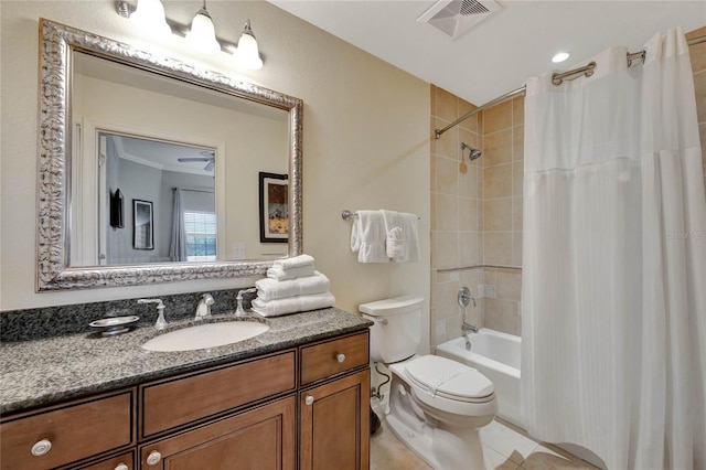 full bathroom featuring shower / bath combo, vanity, toilet, and tile patterned floors