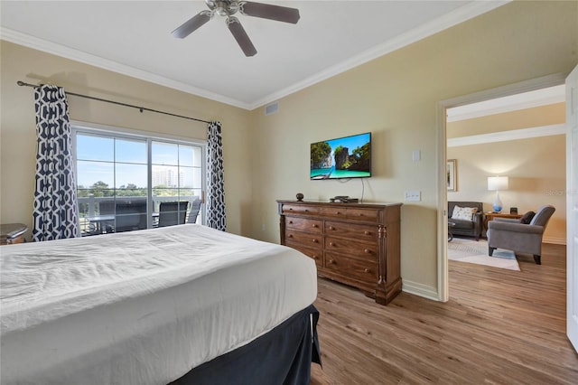 bedroom featuring ceiling fan, ornamental molding, access to exterior, and wood-type flooring