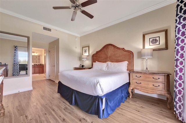 bedroom with light hardwood / wood-style flooring, ensuite bath, ceiling fan, and ornamental molding