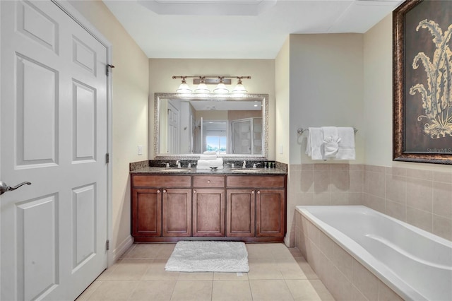 bathroom featuring vanity, shower with separate bathtub, and tile patterned flooring