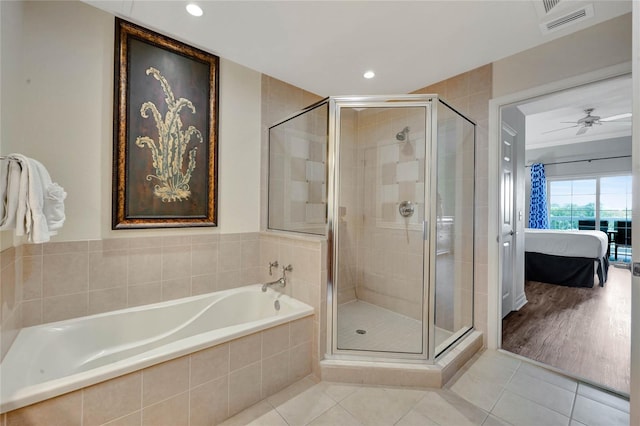 bathroom featuring hardwood / wood-style floors, separate shower and tub, and ceiling fan