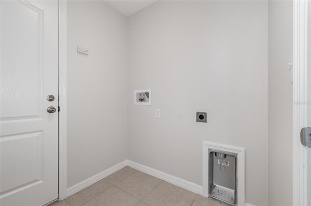 laundry area featuring washer hookup, electric dryer hookup, and light tile patterned floors