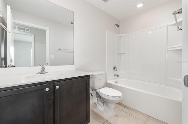 full bathroom with tub / shower combination, vanity, tile patterned flooring, and toilet