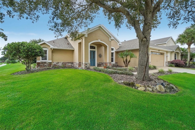 view of front facade with a garage and a front lawn