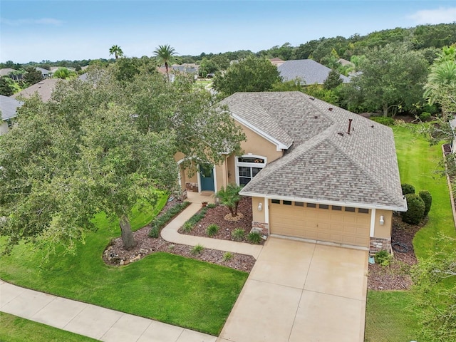 view of front facade featuring a garage and a front yard