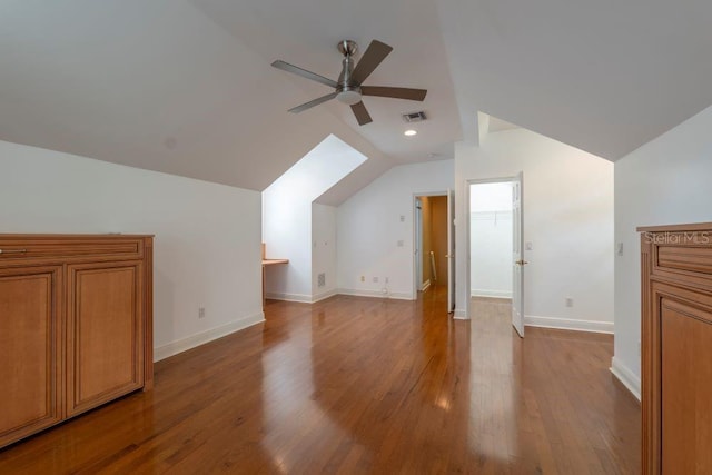 additional living space with ceiling fan, vaulted ceiling, and light hardwood / wood-style floors