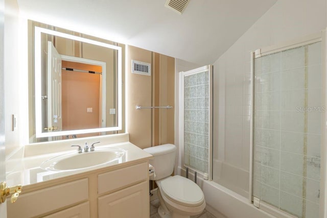 full bathroom featuring enclosed tub / shower combo, vanity, lofted ceiling, and toilet