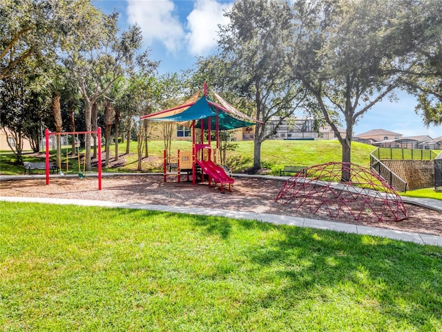 view of jungle gym with a lawn