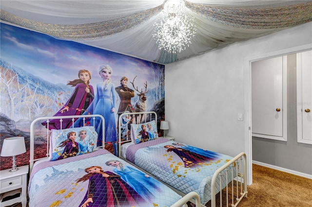 carpeted bedroom featuring a notable chandelier