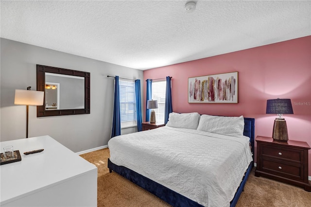 carpeted bedroom featuring a textured ceiling