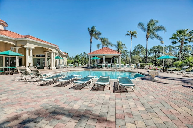 view of swimming pool featuring a patio and a gazebo