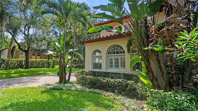 view of home's exterior featuring a lawn