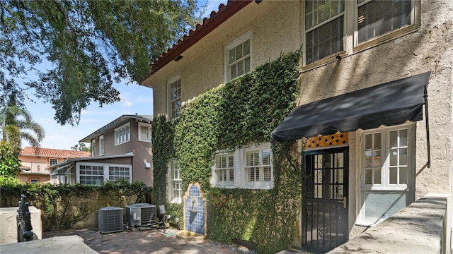 doorway to property with central AC