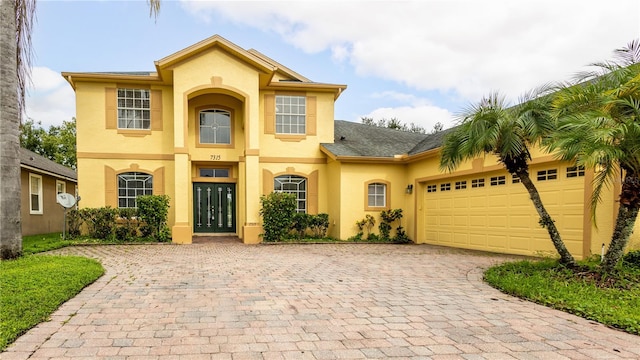 view of front of property with french doors and a garage