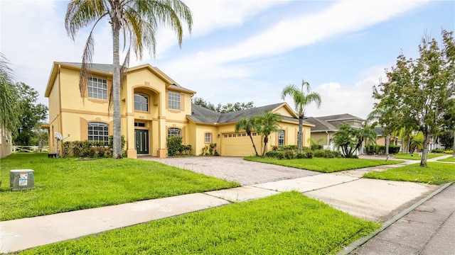 view of front facade with a front yard and a garage