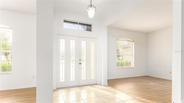 entrance foyer featuring light hardwood / wood-style flooring and plenty of natural light