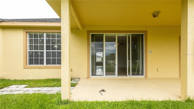 doorway to property with a patio area