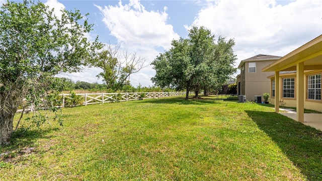 view of yard with central AC