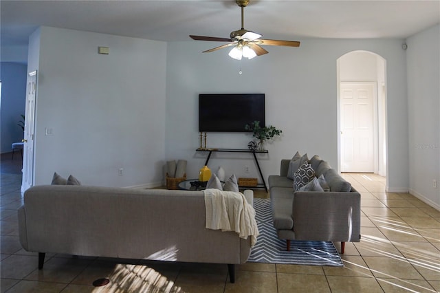 living room featuring tile patterned floors and ceiling fan