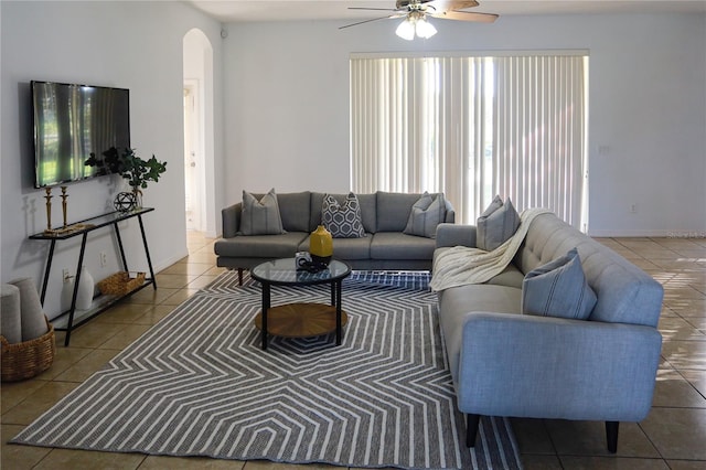 living room with tile patterned floors and ceiling fan