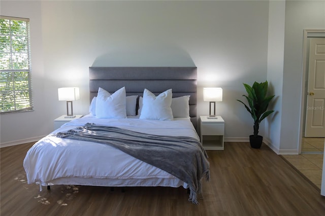 bedroom featuring dark hardwood / wood-style floors