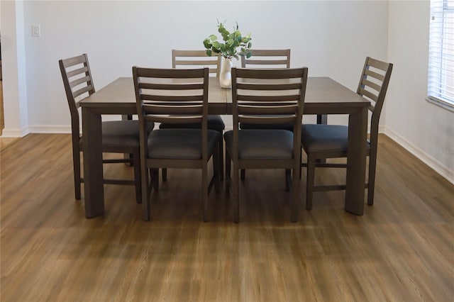 dining area featuring dark hardwood / wood-style floors