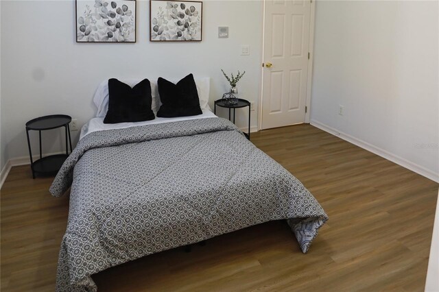 bedroom featuring hardwood / wood-style floors