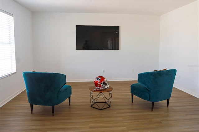 living area with wood-type flooring