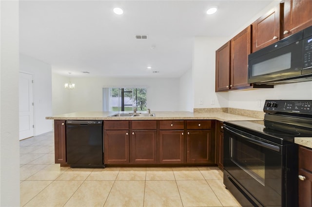 kitchen featuring kitchen peninsula, light tile patterned floors, black appliances, sink, and a notable chandelier