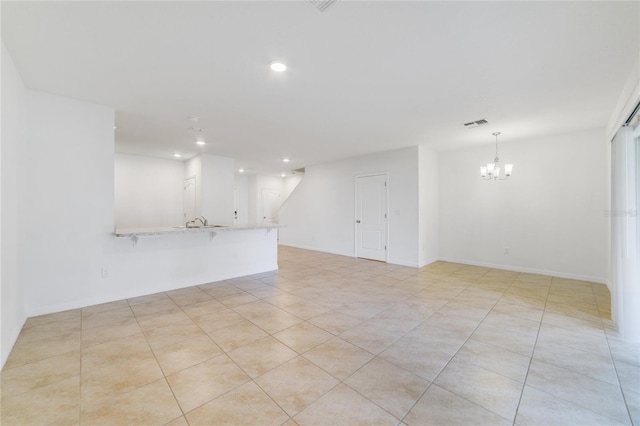 interior space with an inviting chandelier and light tile patterned floors