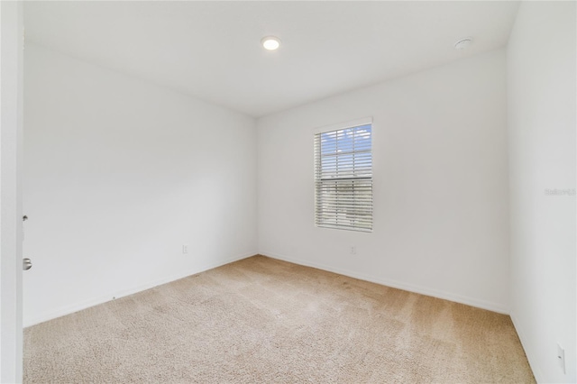 spare room featuring carpet flooring