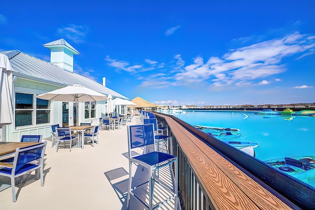 view of patio featuring a water view