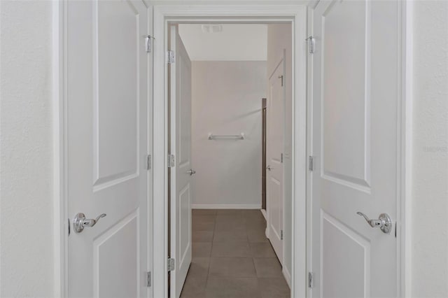 hallway with light tile patterned flooring