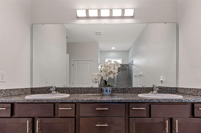 bathroom with a shower and vanity