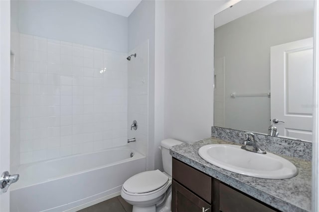 full bathroom with tile patterned floors, toilet, vanity, and tiled shower / bath