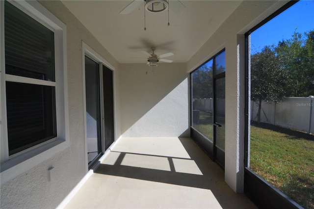 sunroom featuring ceiling fan