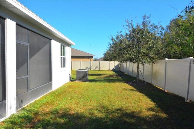 view of yard featuring central air condition unit