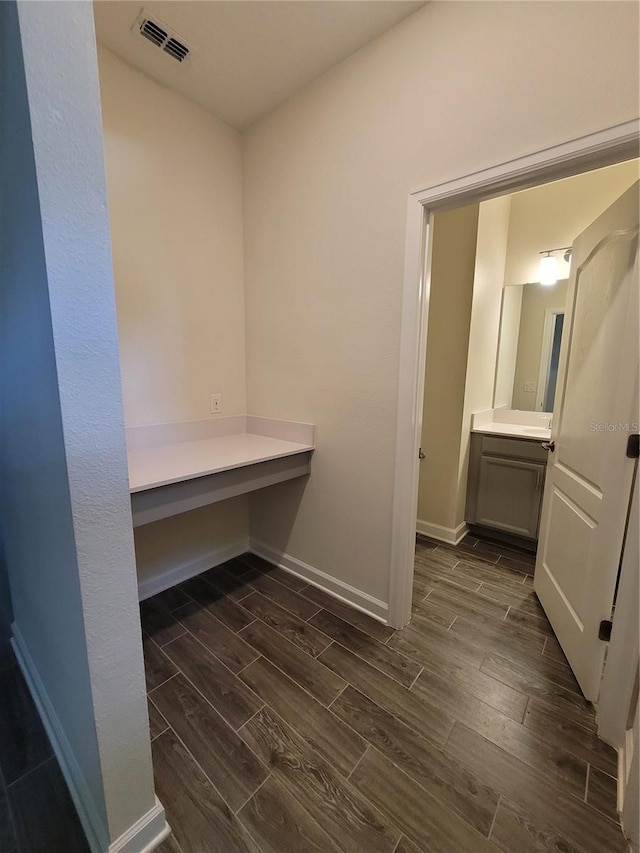 bathroom featuring vanity and hardwood / wood-style flooring