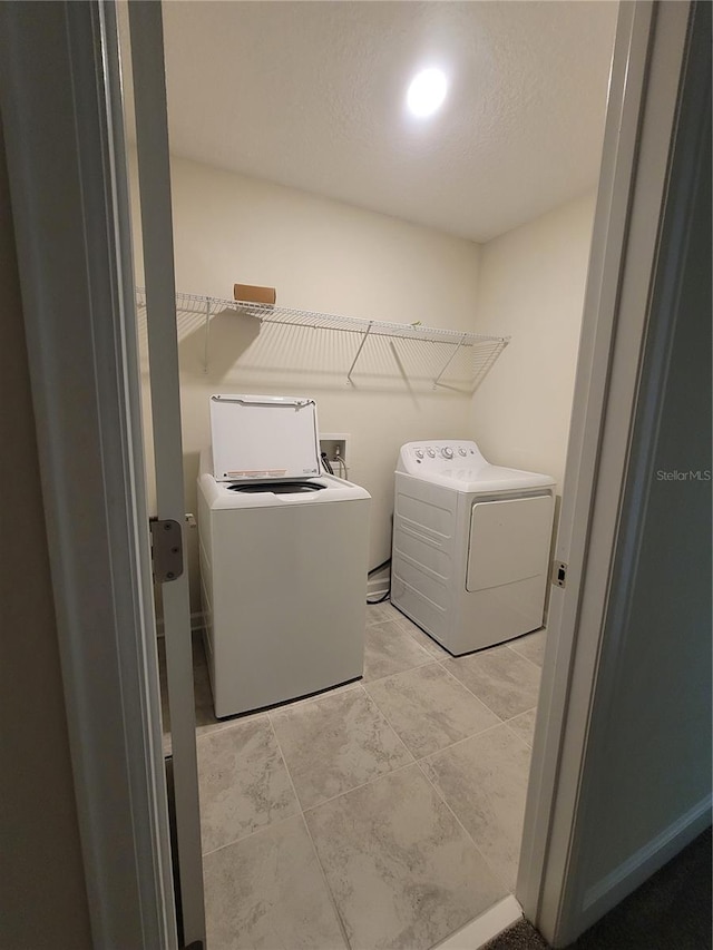 washroom with separate washer and dryer