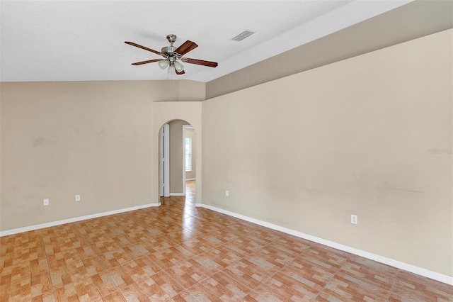 unfurnished room with ceiling fan and vaulted ceiling