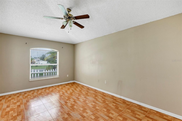 spare room featuring light hardwood / wood-style flooring, ceiling fan, and a textured ceiling